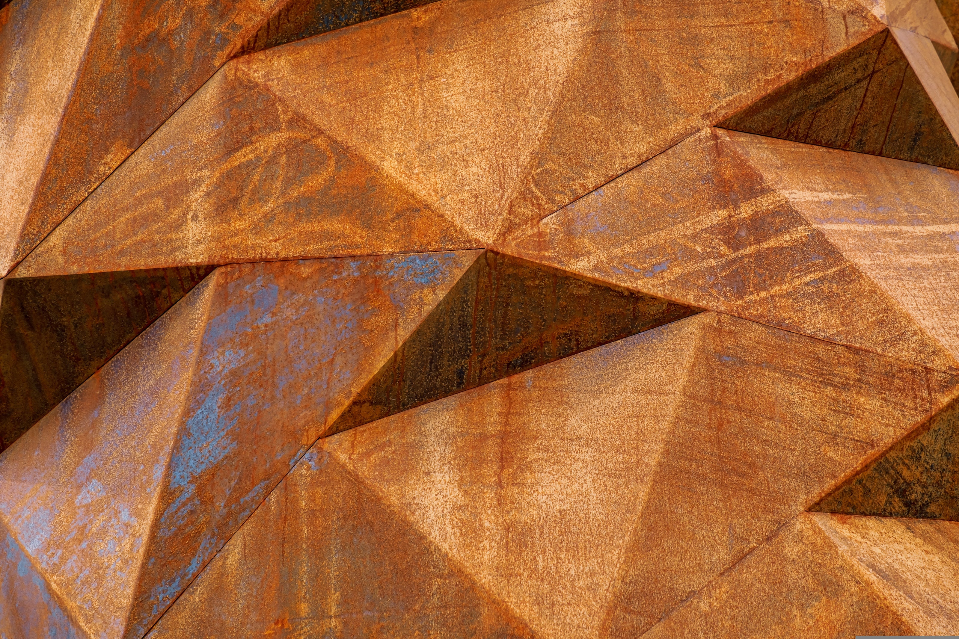 Detail of rust and corrosion on metal, representing Rust Belt conditions